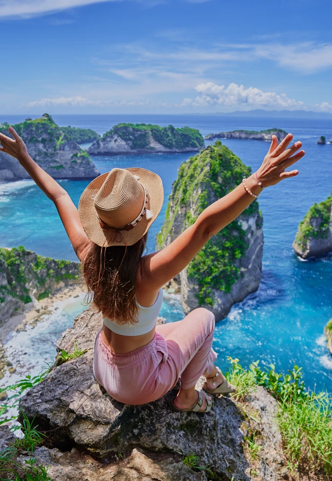 Woman enjoying ocean view from cliff